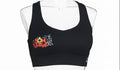 Son Y Tumbao black sports bra with graphic print, racerback, and wide underband. Medium support for workouts.